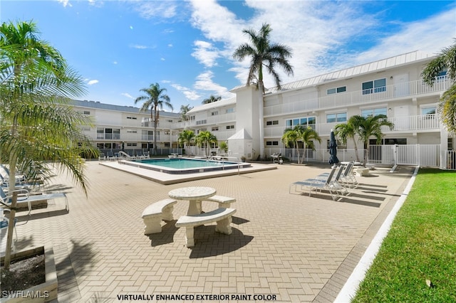 community pool featuring a patio area