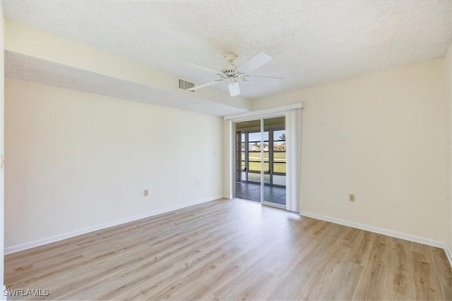 315 Saint Andrews Blvd Unit D5, Naples, FL 34113 - empty room featuring baseboards, a textured ceiling, visible vents, and light wood-type flooring