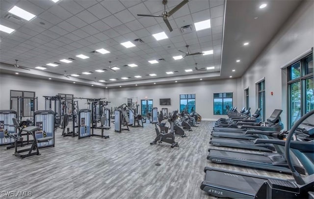 19513 Hinkley Dr, Estero, FL 33928 - exercise room with a towering ceiling, visible vents, a paneled ceiling, and ceiling fan