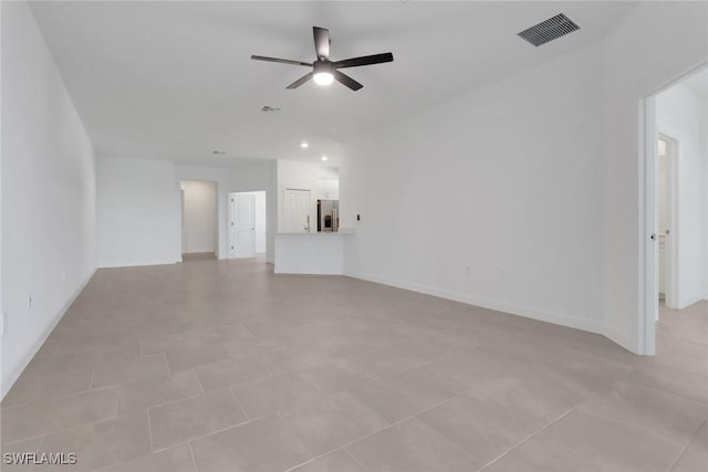 19513 Hinkley Dr, Estero, FL 33928 - unfurnished living room with baseboards, ceiling fan, and visible vents