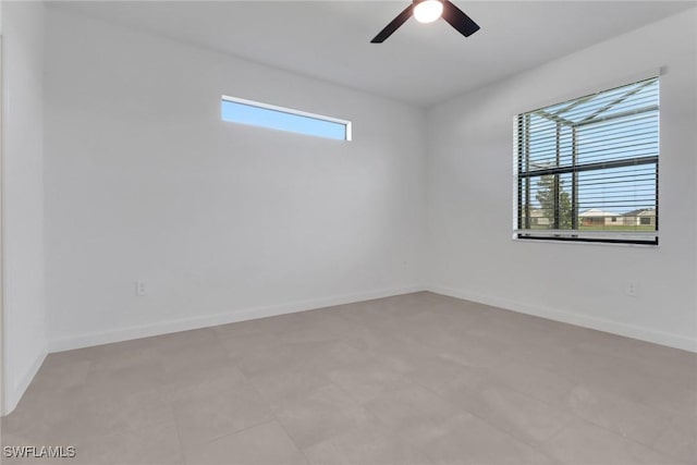 19513 Hinkley Dr, Estero, FL 33928 - spare room with a ceiling fan and baseboards