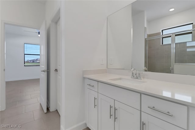 19513 Hinkley Dr, Estero, FL 33928 - bathroom featuring tile patterned floors, vanity, a stall shower, and a healthy amount of sunlight