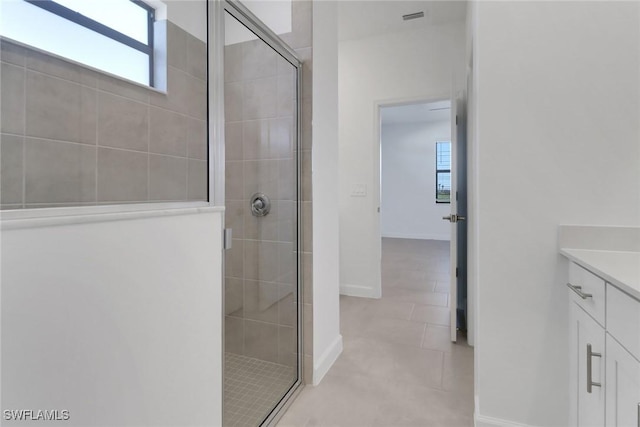 19513 Hinkley Dr, Estero, FL 33928 - full bathroom featuring visible vents, a stall shower, tile patterned floors, and vanity