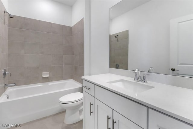 19513 Hinkley Dr, Estero, FL 33928 - bathroom featuring toilet, vanity,  shower combination, and tile patterned flooring
