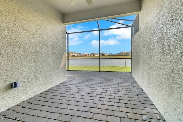 19513 Hinkley Dr, Estero, FL 33928 - unfurnished sunroom featuring a water view