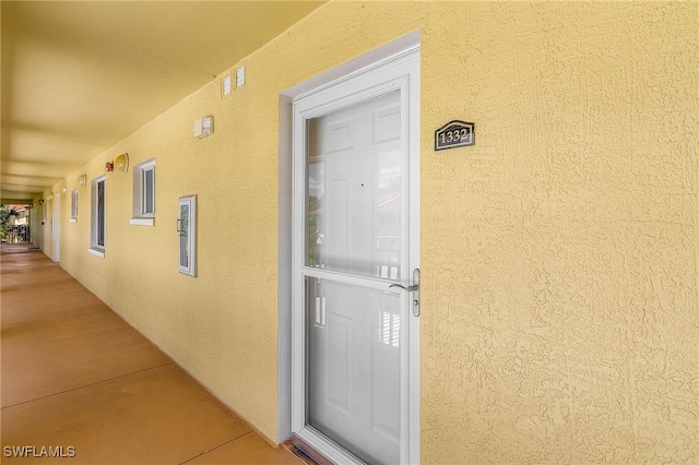8284 Key Royal Cir Unit 1332, Naples, FL 34119 - view of exterior entry with stucco siding