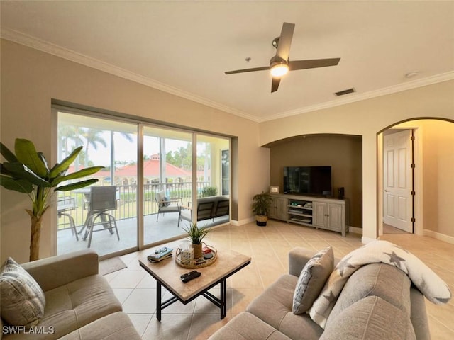 5956 Tarpon Gardens Cir Unit 201, Cape Coral, FL 33914 - living room with light tile patterned floors, arched walkways, visible vents, and baseboards