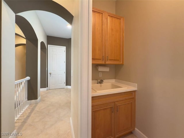5956 Tarpon Gardens Cir Unit 201, Cape Coral, FL 33914 - bathroom with vanity and baseboards