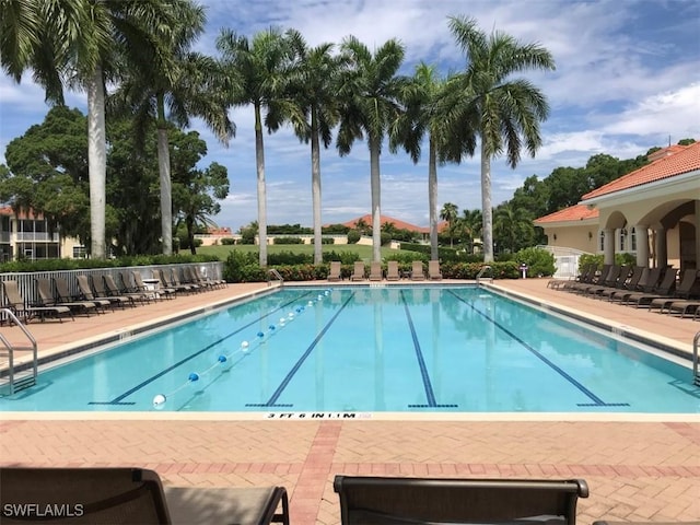 5956 Tarpon Gardens Cir Unit 201, Cape Coral, FL 33914 - community pool with fence and a patio area