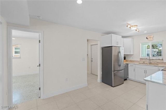 411 Connecticut St, Fort Myers Beach, FL 33931 - kitchen featuring freestanding refrigerator, a sink, white cabinets, dishwashing machine, and recessed lighting