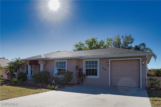 1675 Blue Lake Cir, Punta Gorda, FL 33983 - ranch-style home featuring stucco siding, driveway, a shingled roof, and a garage