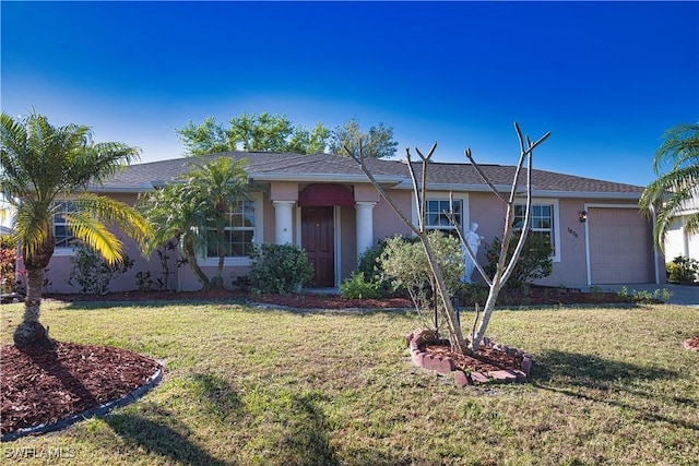 1675 Blue Lake Cir, Punta Gorda, FL 33983 - ranch-style home featuring a front yard, an attached garage, and stucco siding