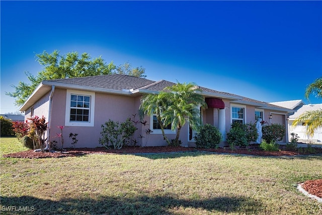 1675 Blue Lake Cir, Punta Gorda, FL 33983 - ranch-style house with stucco siding, an attached garage, and a front lawn
