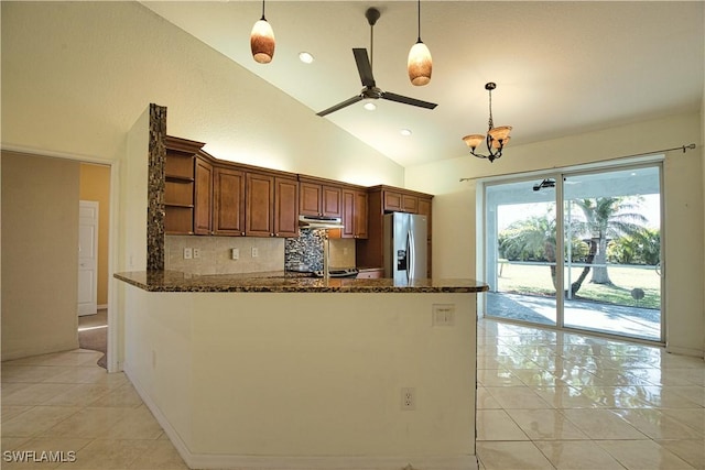 1675 Blue Lake Cir, Punta Gorda, FL 33983 - kitchen featuring ceiling fan with notable chandelier, stainless steel fridge with ice dispenser, dark stone counters, and open shelves