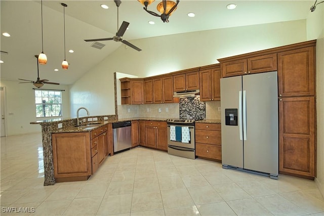 1675 Blue Lake Cir, Punta Gorda, FL 33983 - kitchen featuring a ceiling fan, under cabinet range hood, a sink, appliances with stainless steel finishes, and a peninsula