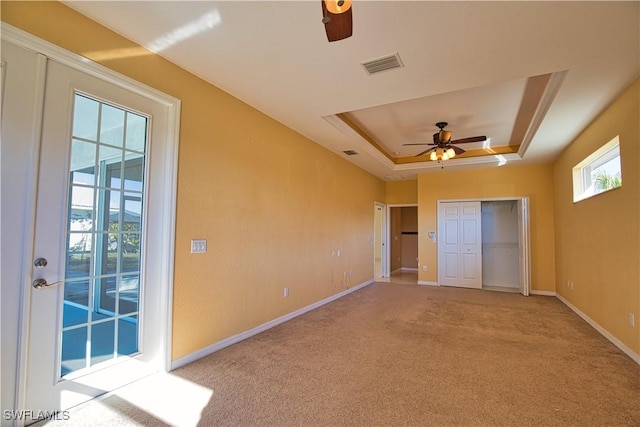 1675 Blue Lake Cir, Punta Gorda, FL 33983 - unfurnished bedroom with a raised ceiling, access to exterior, visible vents, and baseboards