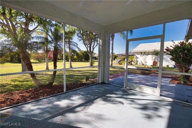 1675 Blue Lake Cir, Punta Gorda, FL 33983 - unfurnished sunroom featuring ceiling fan