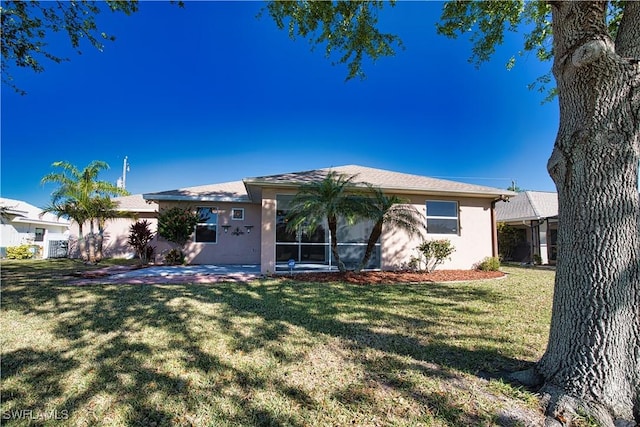 1675 Blue Lake Cir, Punta Gorda, FL 33983 - view of front facade with stucco siding and a front yard