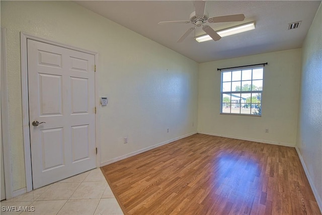 1675 Blue Lake Cir, Punta Gorda, FL 33983 - unfurnished room with light wood-style flooring, a ceiling fan, visible vents, and baseboards