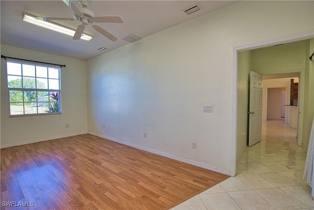 1675 Blue Lake Cir, Punta Gorda, FL 33983 - empty room featuring light wood-type flooring, baseboards, visible vents, and ceiling fan