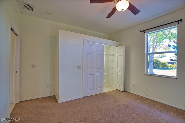 1675 Blue Lake Cir, Punta Gorda, FL 33983 - unfurnished bedroom featuring visible vents, light carpet, baseboards, and connected bathroom