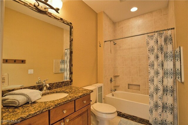 1675 Blue Lake Cir, Punta Gorda, FL 33983 - full bathroom with shower / bath combo with shower curtain, toilet, recessed lighting, tile patterned flooring, and vanity