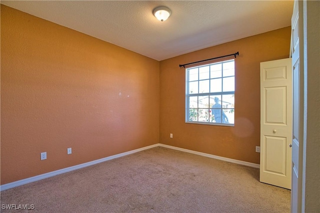 1675 Blue Lake Cir, Punta Gorda, FL 33983 - carpeted empty room featuring baseboards and a textured ceiling