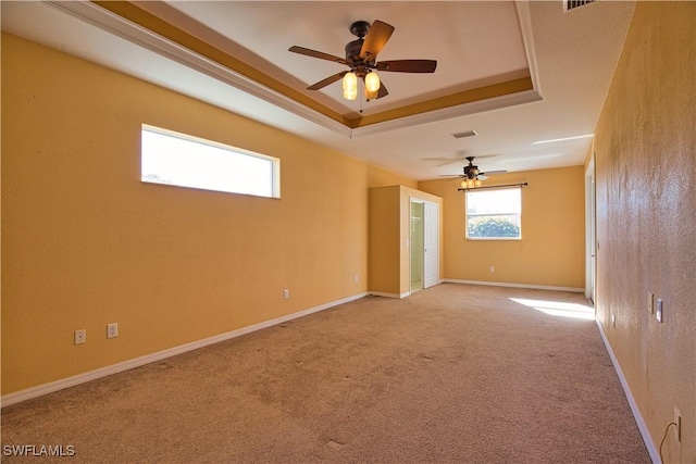 1675 Blue Lake Cir, Punta Gorda, FL 33983 - carpeted spare room with baseboards, a ceiling fan, and a tray ceiling