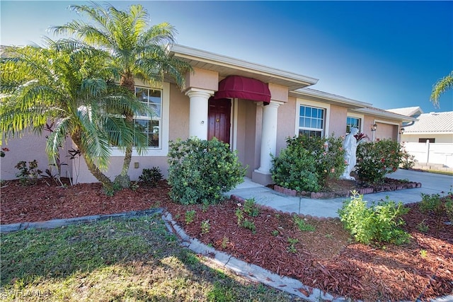 1675 Blue Lake Cir, Punta Gorda, FL 33983 - view of front of property with stucco siding and an attached garage