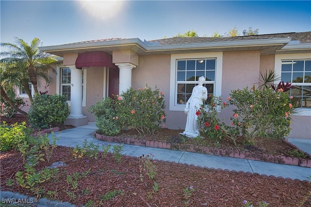 1675 Blue Lake Cir, Punta Gorda, FL 33983 - view of front of house featuring stucco siding