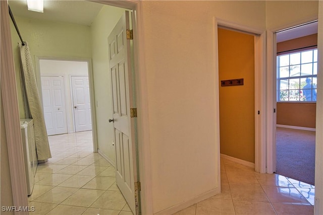 1675 Blue Lake Cir, Punta Gorda, FL 33983 - hallway with light tile patterned floors and baseboards