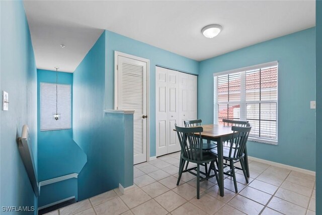 4970 Deerfield Way Unit F202, Naples, FL 34110 - dining room with baseboards and tile patterned floors