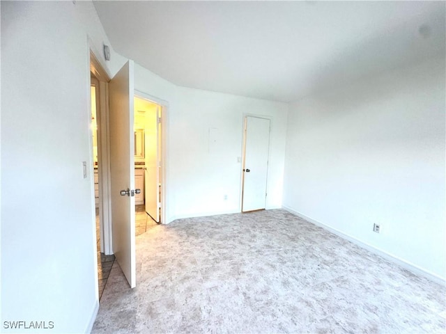 177 Santa Clara Dr Unit 177-5, Naples, FL 34104 - empty room with carpet floors and baseboards