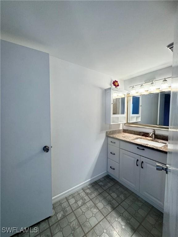 177 Santa Clara Dr Unit 177-5, Naples, FL 34104 - bathroom featuring vanity and baseboards