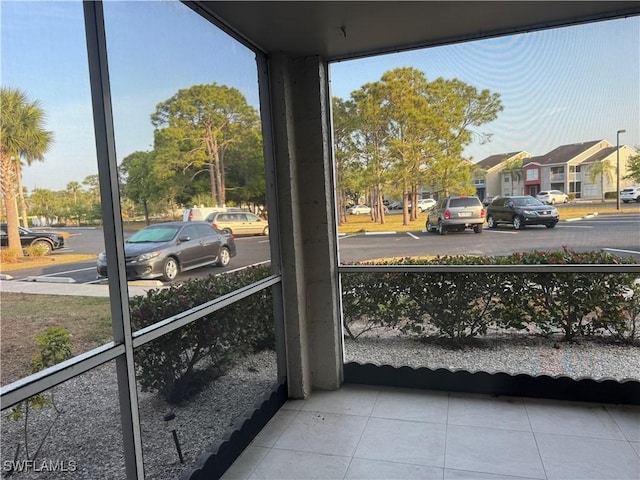 177 Santa Clara Dr Unit 177-5, Naples, FL 34104 - sunroom / solarium featuring a residential view