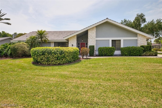15440 Kilmarnock Dr, Fort Myers, FL 33912 - view of front of house with stone siding, stucco siding, and a front lawn
