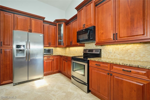 15440 Kilmarnock Dr, Fort Myers, FL 33912 - kitchen featuring backsplash, light stone countertops, appliances with stainless steel finishes, glass insert cabinets, and a toaster