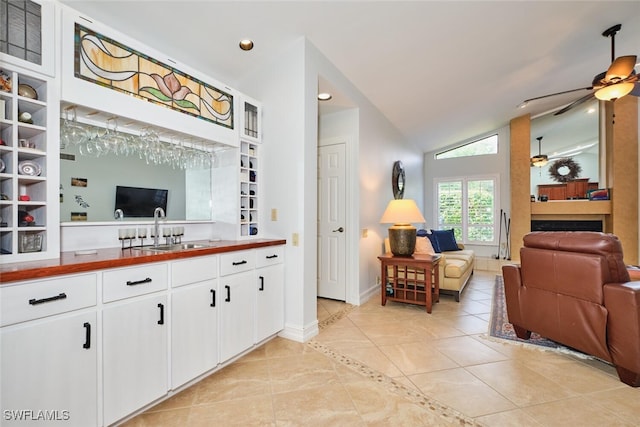 15440 Kilmarnock Dr, Fort Myers, FL 33912 - living room with light tile patterned flooring, baseboards, ceiling fan, recessed lighting, and lofted ceiling