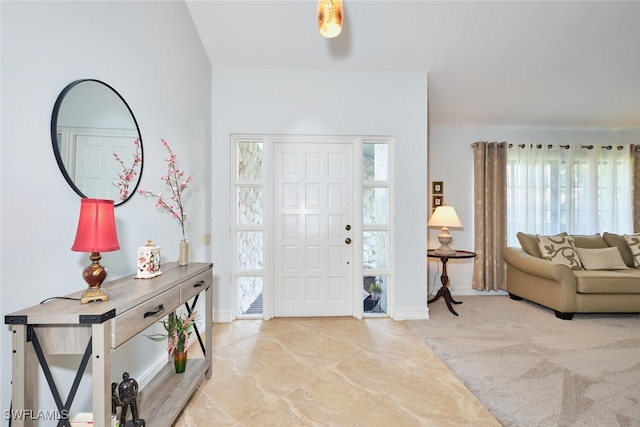 15440 Kilmarnock Dr, Fort Myers, FL 33912 - carpeted entryway featuring baseboards