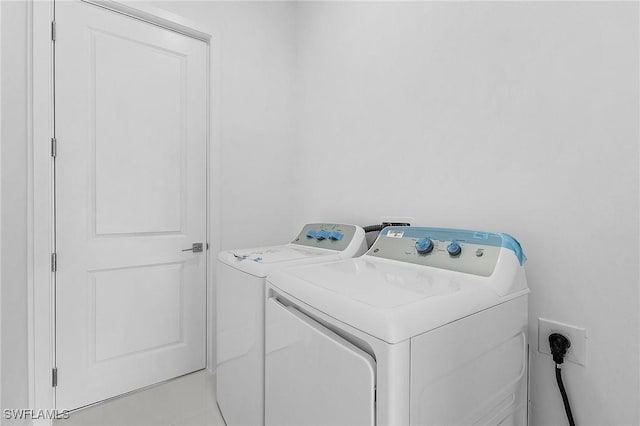 231 NW 27th Ave, Cape Coral, FL 33993 - clothes washing area with laundry area and washing machine and dryer