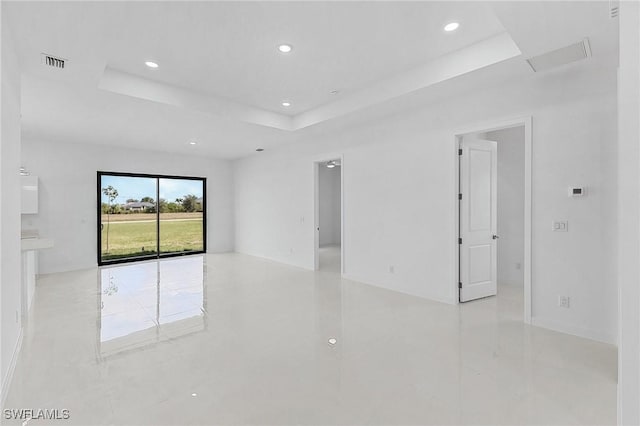 231 NW 27th Ave, Cape Coral, FL 33993 - spare room featuring visible vents, recessed lighting, attic access, and a raised ceiling