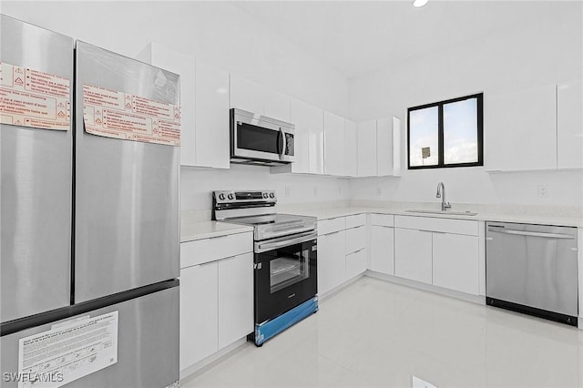 231 NW 27th Ave, Cape Coral, FL 33993 - kitchen with modern cabinets, a sink, stainless steel appliances, white cabinets, and light countertops