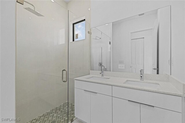 231 NW 27th Ave, Cape Coral, FL 33993 - bathroom with double vanity, a shower stall, and a sink