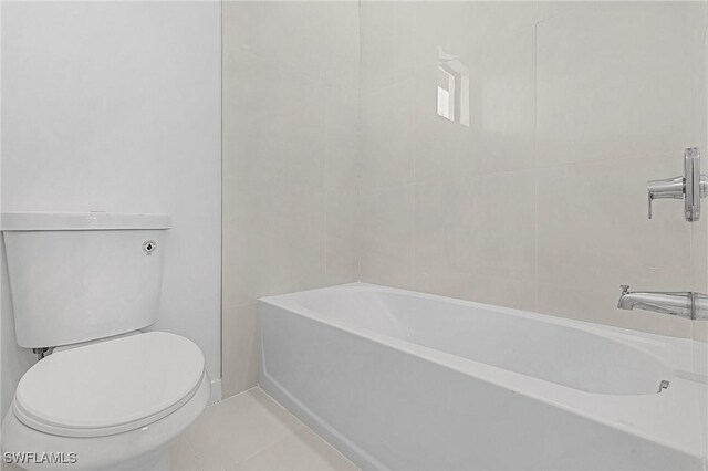 231 NW 27th Ave, Cape Coral, FL 33993 - full bath featuring tile patterned floors, a bathing tub, toilet, and walk in shower