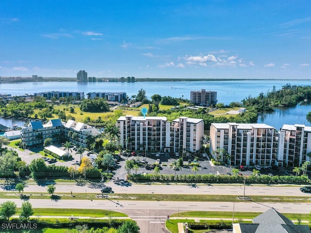 drone / aerial view of a large body of water and apartment complex