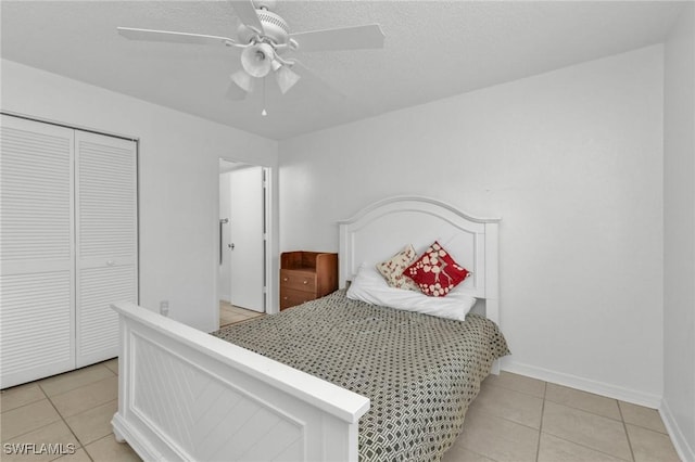 25100 Sandhill Blvd Unit 103, Punta Gorda, FL 33983 - bedroom with light tile patterned floors, baseboards, a closet, and ceiling fan