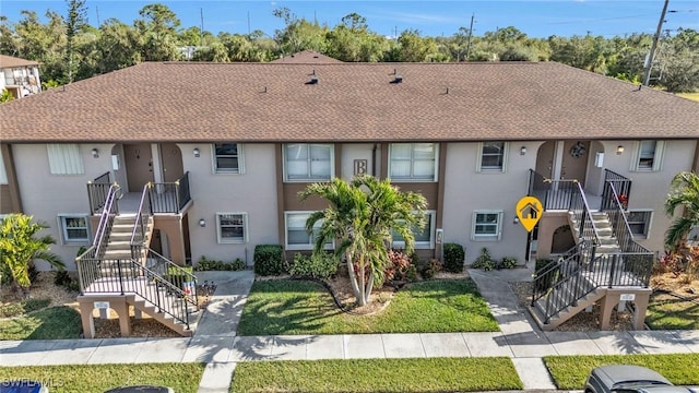 25100 Sandhill Blvd Unit 103, Punta Gorda, FL 33983 - multi unit property featuring stairway, stucco siding, and a shingled roof