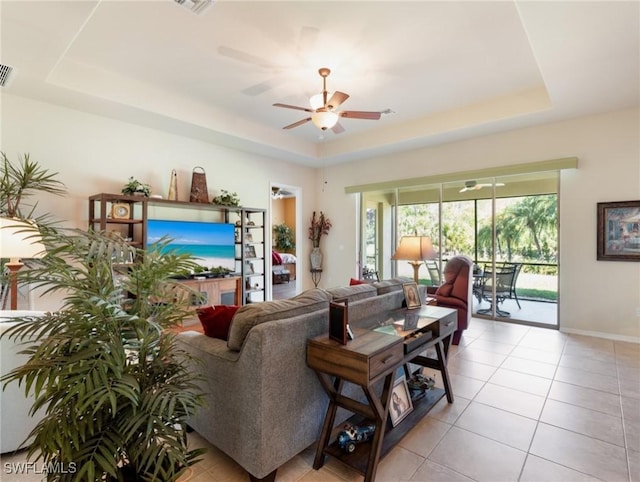 21826 Bella Terra Blvd, Estero, FL 33928 - living area featuring a raised ceiling, visible vents, light tile patterned floors, and ceiling fan