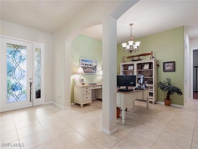 21826 Bella Terra Blvd, Estero, FL 33928 - foyer entrance featuring baseboards, a notable chandelier, arched walkways, and light tile patterned floors