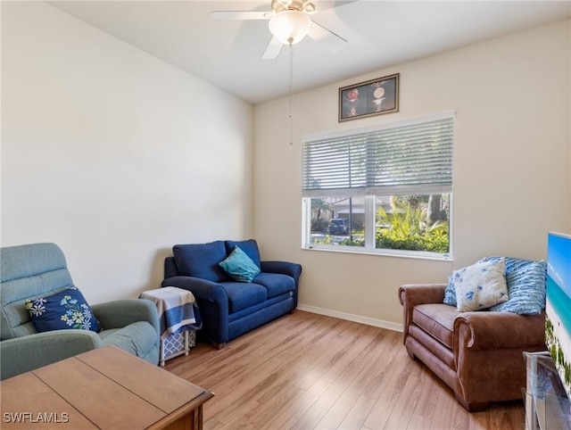 21826 Bella Terra Blvd, Estero, FL 33928 - living area featuring baseboards, light wood-style floors, and ceiling fan